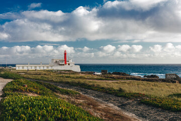 Fototapeta na wymiar Cabo Raso, an active Portuguese lighthouse that is located in the Fort of São Brás of Sanxete, near Cascais, Lisbon District, Portugal.