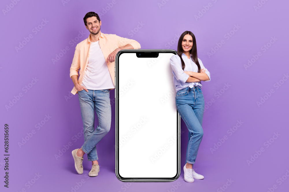 Poster full length portrait of two attractive people crossed hands demonstrate big empty space smart phone 