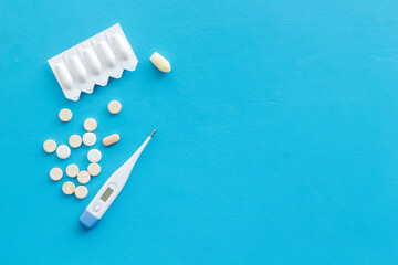 Medical treatment concept with thermometer pills and rectal suppositories