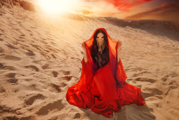 Mystery arabic woman sits in desert, gold mask veil accessories niqab burqa hide face. Fantasy girl...