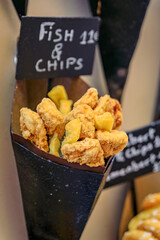 A display cone of fritto misto street food mix of fried fish and chips for 11 EUR in the old town...