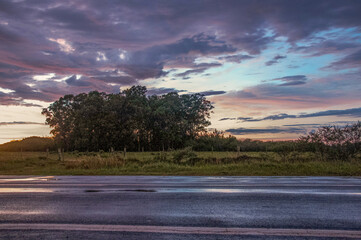 Asphalt road in the countryside with beautiful sky , brazil