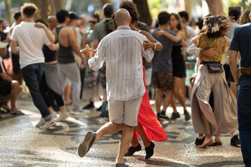 Couple dancing bachata on the street