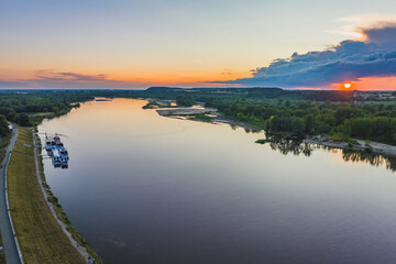 Fototapeta premium The lazy and calm Vistula flowing through Kazimierz Dolny on a beautiful summer day.