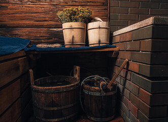 Interior details Finnish sauna steam room with traditional sauna accessories basin birch broom...
