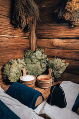 Interior details Finnish sauna steam room with traditional sauna accessories basin birch broom...
