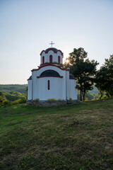 Obraz premium Orthodox Christian church. Vintage church in the wild. Church of St. John the Baptist in Kacapor settlement, Blace municipality, Serbia. 
