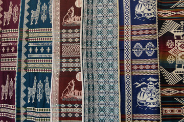 Colorful woven traditional fabric with inca designs for sale at Otavalo market in Ecuador