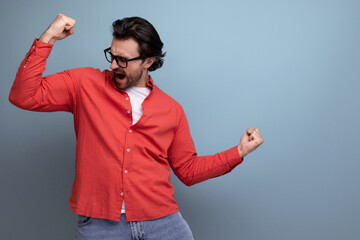 stylish european 35 year old man in casual shirt showing muscles