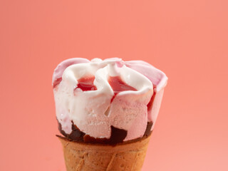 Strawberry ice cream in waffle cups. Ice cream on a pink background.