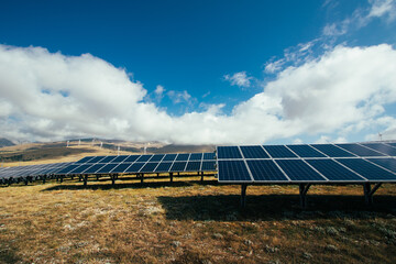 solar panel industry on the yellow  and green mountain fields for environmentally sustainable green...