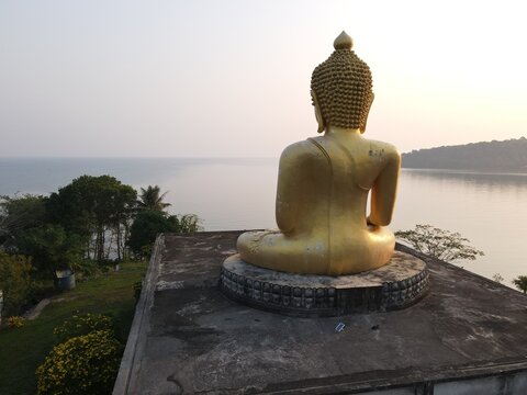 The big golden Buddha image is Luang Pho Phutthapadeep Srisathaporn.  Located at Koh Kood, Thailand