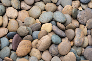 Round pebble stones background, rough texture of the stone, material for the garden decoration