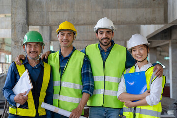 team of civil engineer manager, maintenance supervisor, professional technician foreman together with safety operator inspect and discuss the infrastructure of building construction progress at site