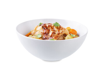 Moroccan spiced chicken with zucchini and carrots in a plate on a white isolated background