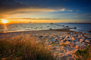 Amazing sunset on the beach at Baltic Sea in Gdansk, Poland