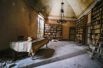 library of abandoned building with books and dust