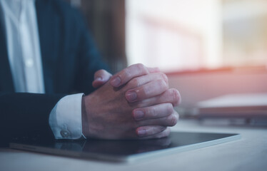 Hands of a thoughtful, hr recruiter making hiring decision at difficult job interview, opponents...