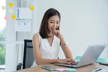asian beautiful woman working at office