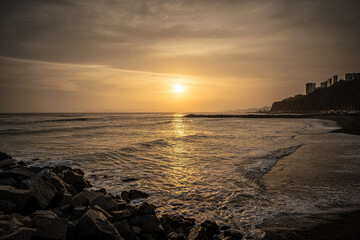 Sunset on a peruvian beach in Lima - 628602850