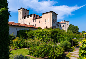 Fototapeta na wymiar Garden of the historic castle in Angera. (“Rocca di Angera“) on a sunny summer day. The medieval fortress is a monument and tourist attraction on lake “Lago Maggiore“ near Milan, northern Italy.