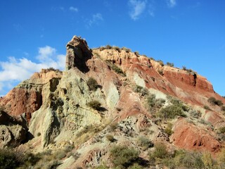 sandstone and limestone mountain with eroded peak