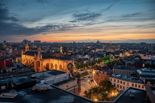 Brussels city center, Belgium - Colorful sunset over old town with the Saint Catherine church and rooftops