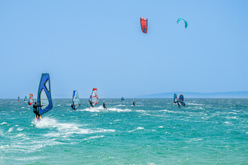 Kitesurfing on Valdevaqueros beach, Gibraltar Strait in Tarifa, Spain on June 17, 2023