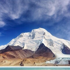 Looking up at Muztagh Tower, known as the father of glaciers, from Pamirs Karakul Lake