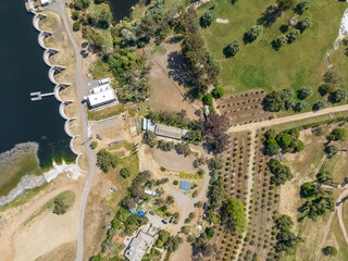 Aerial view over water reservoir and a large dam that holds water. Rancho Santa Fe in San Diego,...