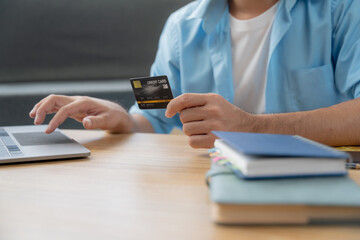 Man hands using laptop and holding credit card with social media as Online shopping concept in morning light