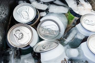 Aluminum can of carbonated soft drink in a container with ice