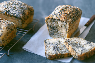 Homemade healthy freshly baked organic whole grain bread with seeds on concrete table. Vegan keto diet. top view