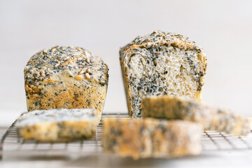 Homemade healthy freshly baked organic whole grain bread with seeds on concrete table. Vegan keto diet. top view