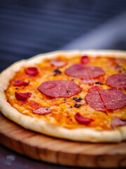 Delicious italian thin crust pizza with beef pepperoni and cheese for hang out with friends in a cafe