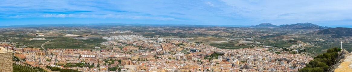 Fototapeta na wymiar Panoramic city view from Medieval castle of Santa Catalina in sunny day in Jaen, Spain