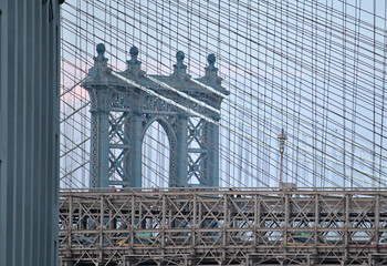 view of manhattan bridge detail through the brooklyn bridge (lines, perspective) suspension bridge...