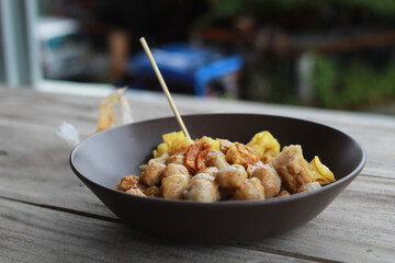 The small pentol and batagor are smothered in a delicious peanut sauce