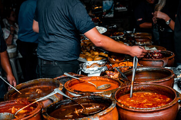 Variety assortment of local traditional Guatemalan food served in big rustic clay pots