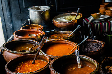 Variety assortment of local traditional Guatemalan food served in big rustic clay pots