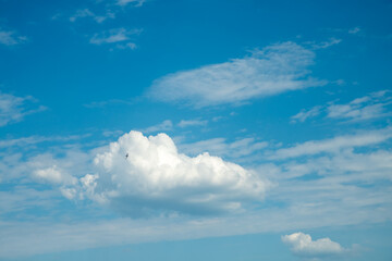 Beautiful cumulus clouds in the blue sky. swallows, natural summer background