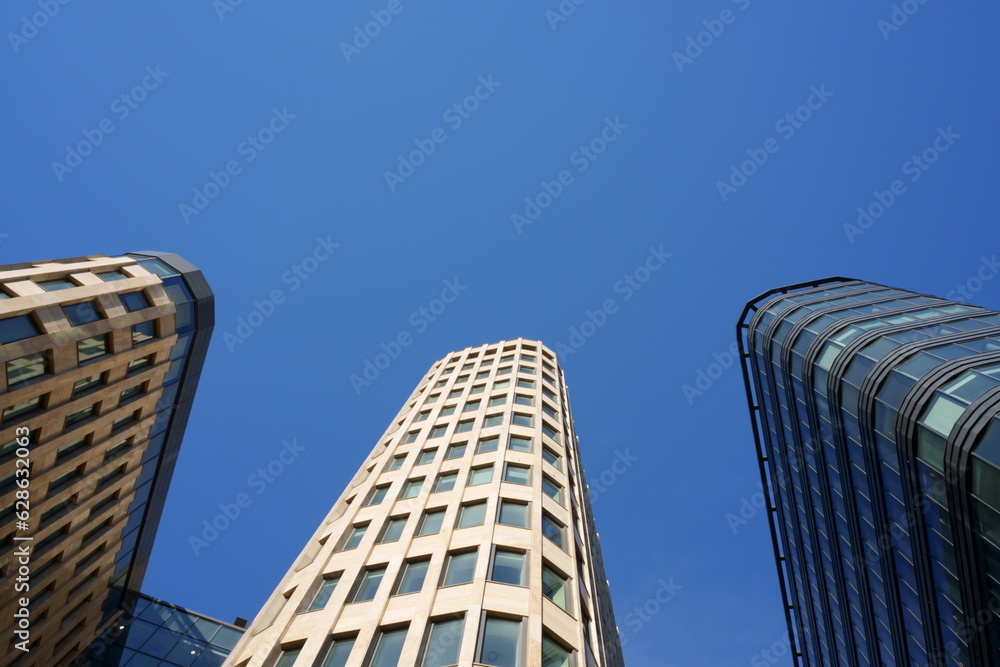 Wall mural morden office buildings against blue sky on a sunny day. high quality photo