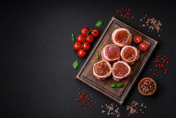 Delicious raw fresh pork or chicken meat rolls wrapped in bacon