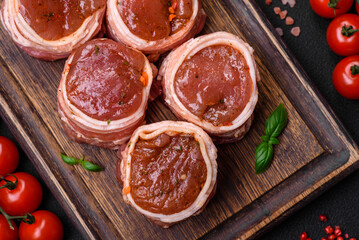 Delicious raw fresh pork or chicken meat rolls wrapped in bacon