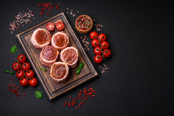 Delicious raw fresh pork or chicken meat rolls wrapped in bacon