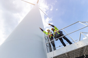 Wind turbine engineer technician male team working service maintenance survey construction site....