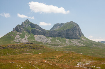 Fototapeta na wymiar The Durmitor National Park is in located a wide mountain region. Mountain peak saddle. 