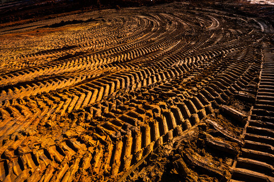 Red clay rich dirt with tractor tire tracks at a construction site in Tennessee