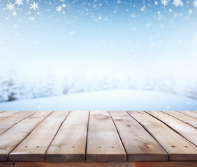 snowy wooden desk on winter background with snowflakes