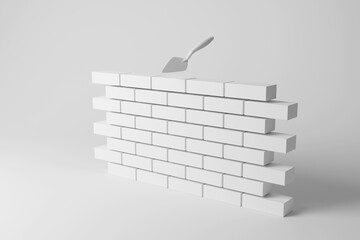 White brick wall and trowel on white background in monochrome and minimalism. Illustration of the concept of brickworks
